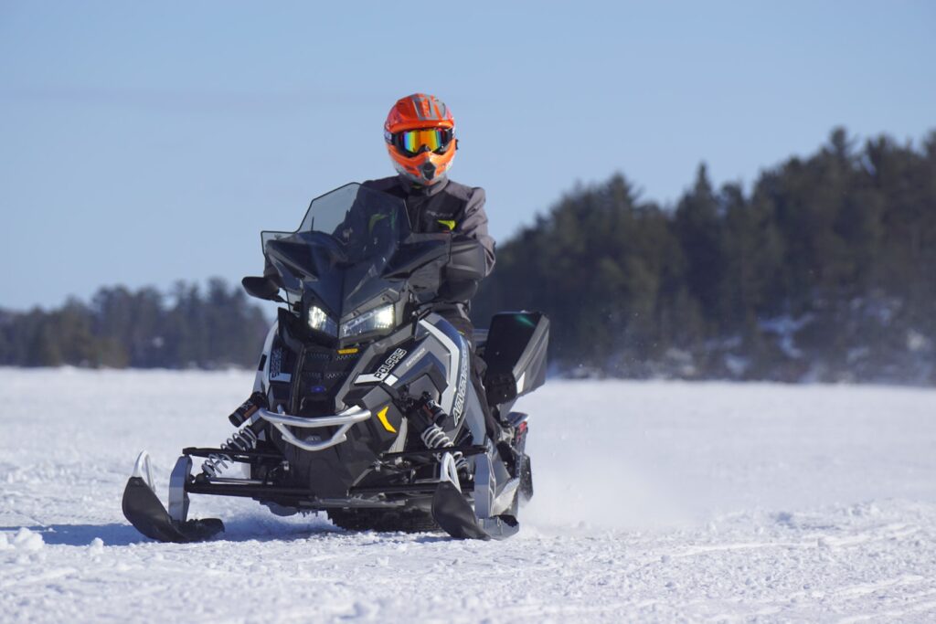 Snowmobiling across the frozen lakes is one of the best things to do in Haliburton