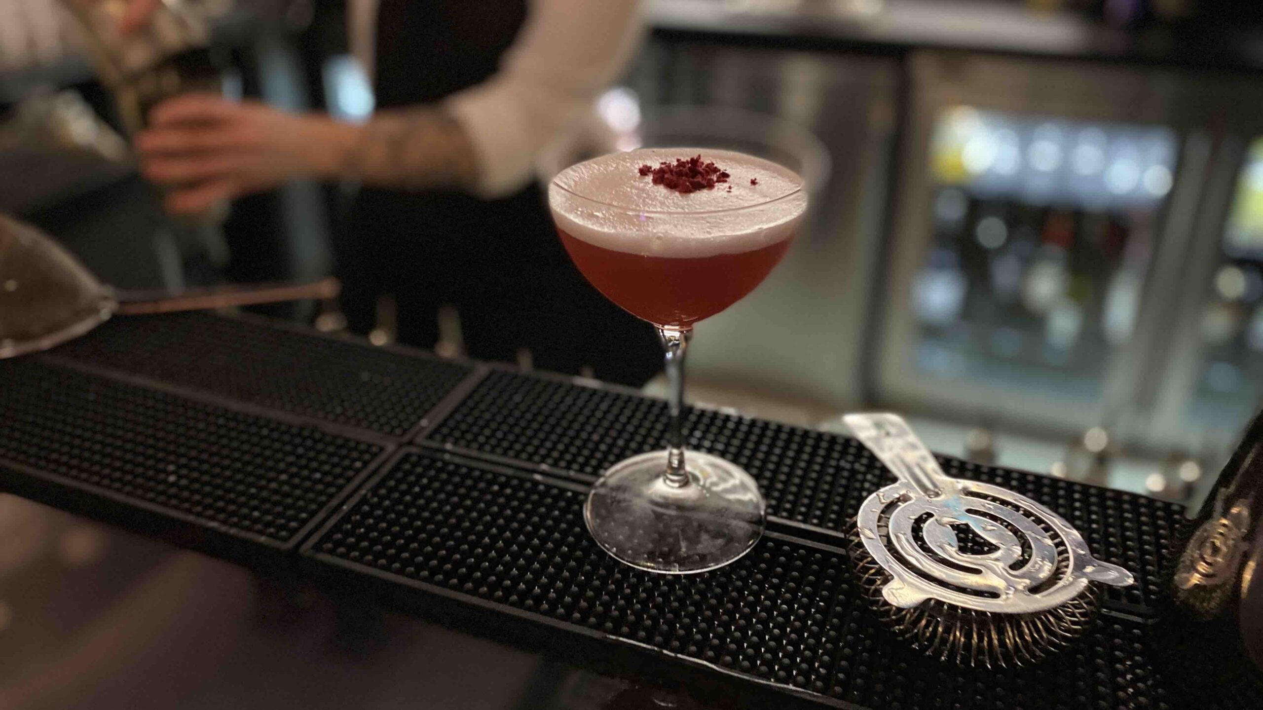 The Bank Gastrobar server shaking up a cocktail