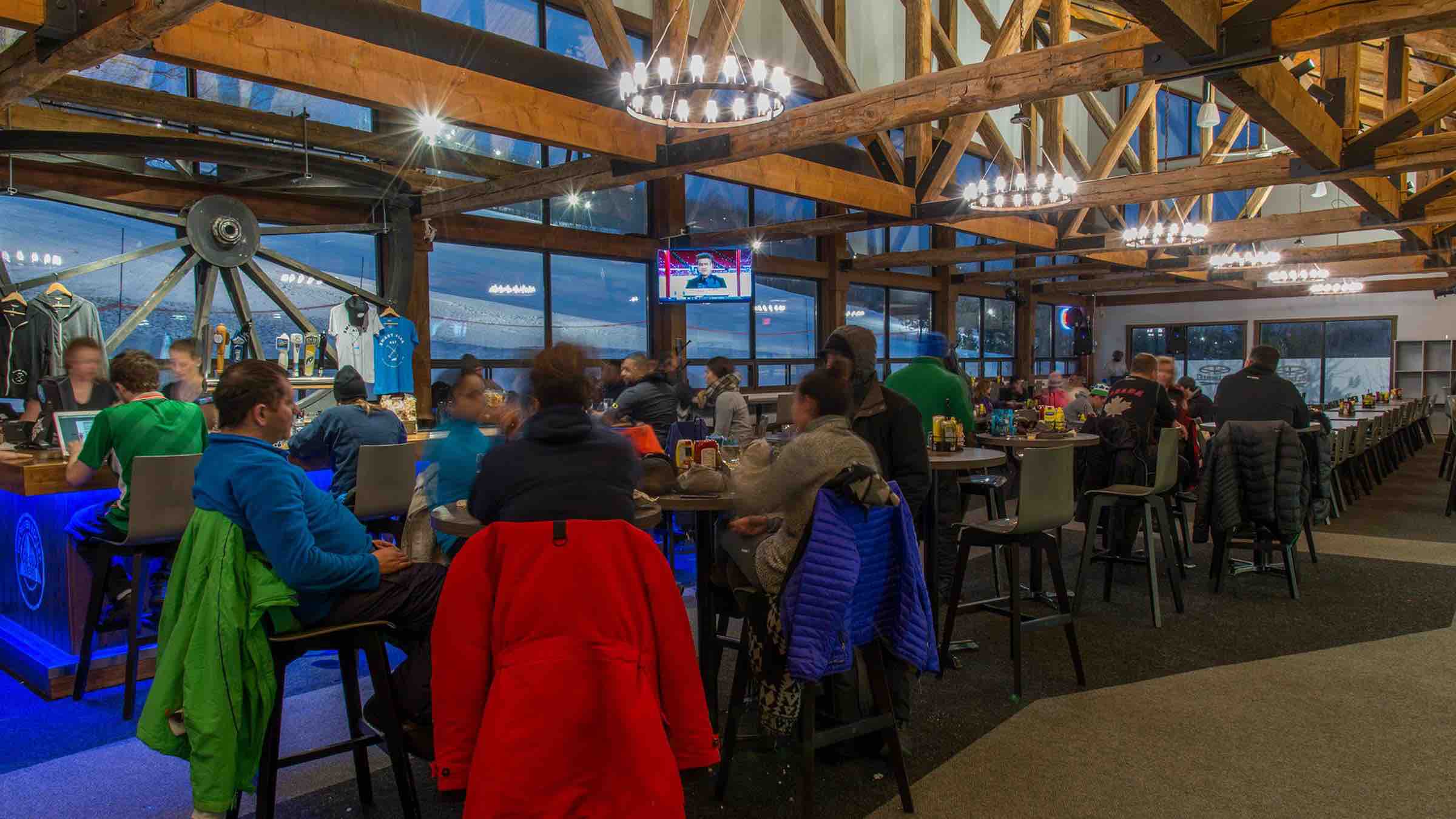 Dining with friends at the Bullwheel Pub is one of the best things to do in Blue Mountain Village in winter - best ski resorts in Ontario