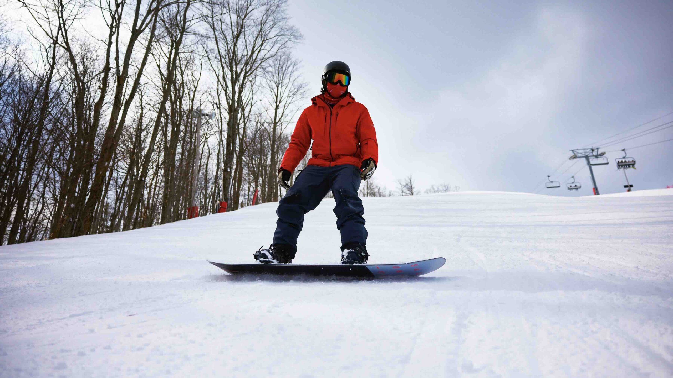 Slopeside at Hoseshoe Resort snowboarder at one of the best luxury ski resorts in Ontario