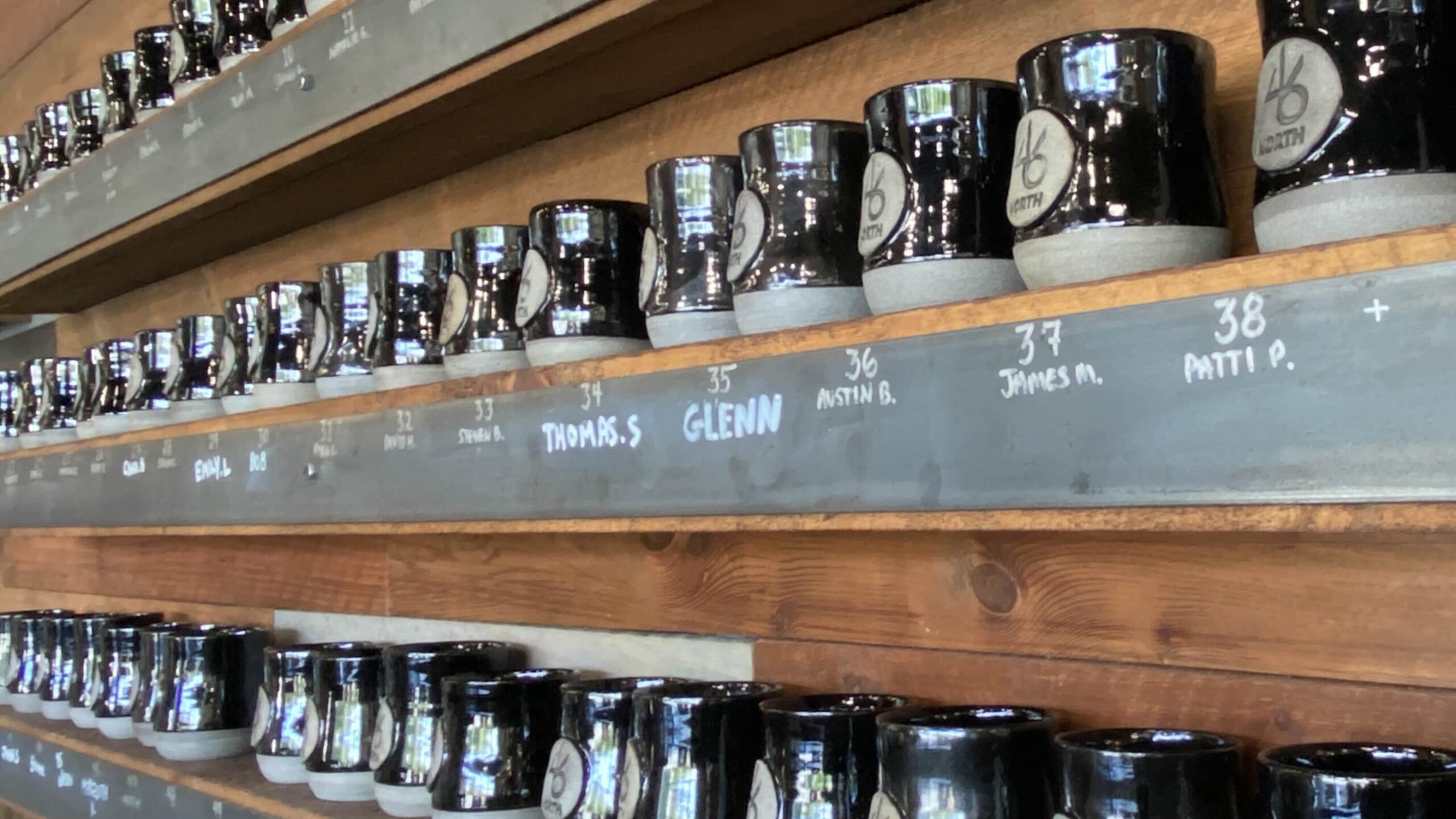 46 North Brewing in Sudbury wall of regular mugs
