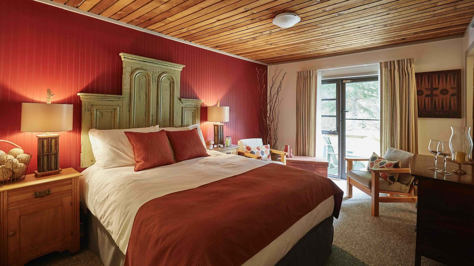 Bedroom with bright window at Arowhon is one of the Best Algonquin Park Resorts