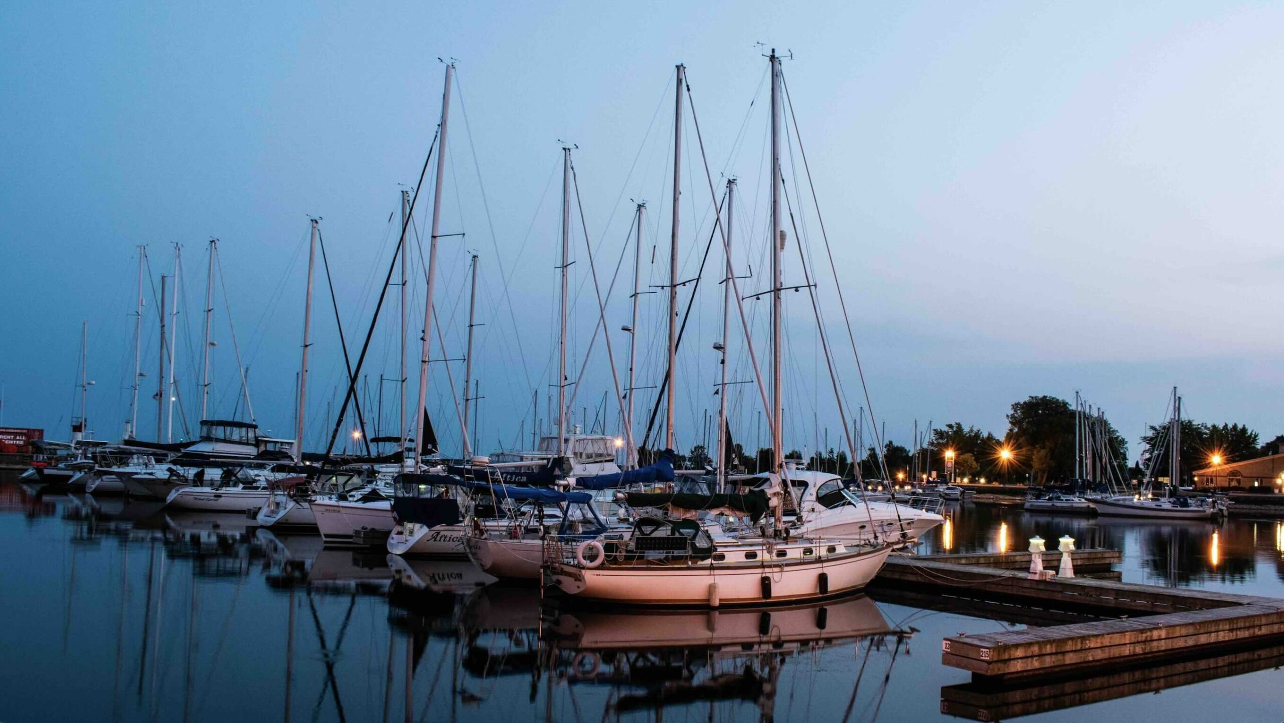 Coburg - shutterstock- danpichartphotos boats in marina at nightfall