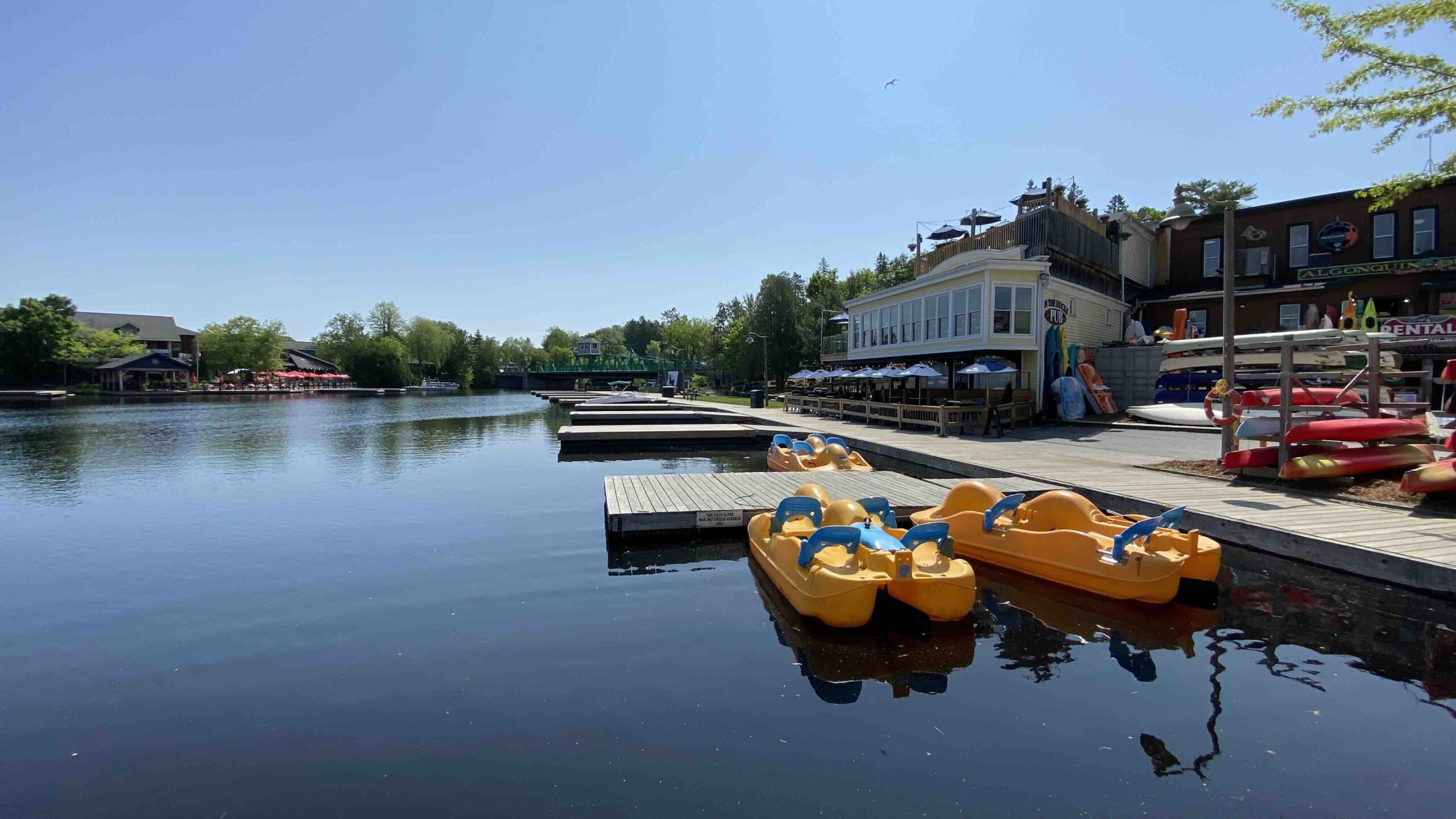 Huntsville Waterfront with boats in summer in one of the best small towns in Ontario photo by Bryan Dearsley
