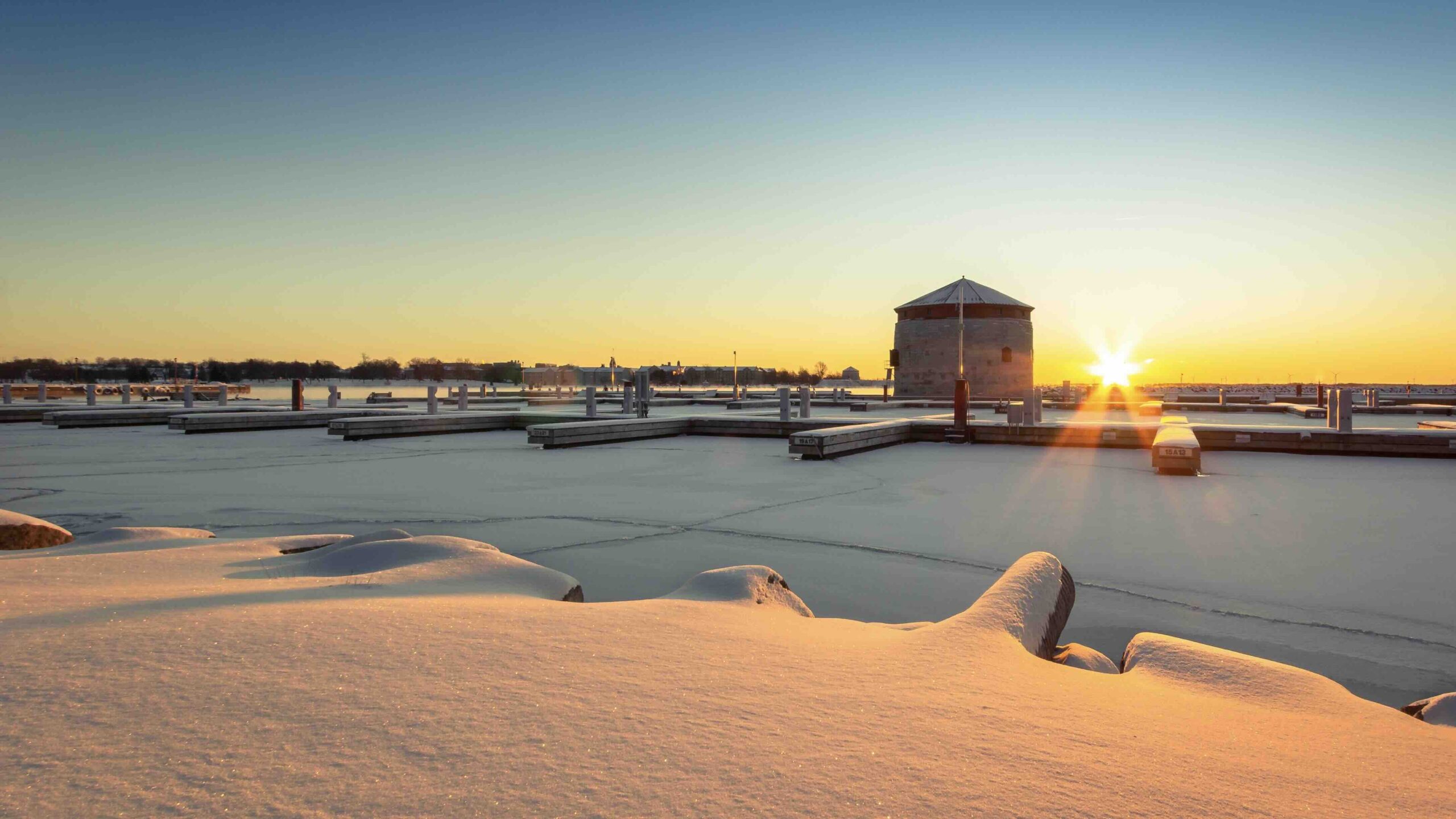 evi-t-Kingston Sunrise in winter-unsplash best winter getaways in Ontario in Kingston Ontario snow and waterfront