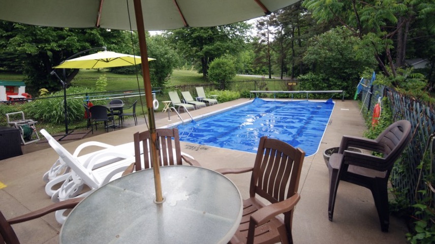 Ogopogo is one of the best Resorts in Haliburton Hotels swimming pool and pool deck with chairs